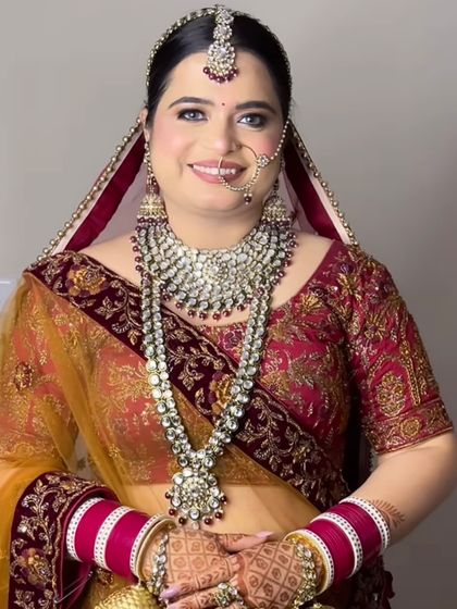 A smiling portrait of the bride, her happiness shining through.
