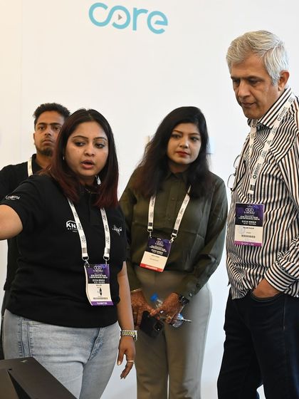 Our founder demonstrating a product to visitors at our exhibition booth. We believe in hands-on experiences to show the true potential of smart home technology.