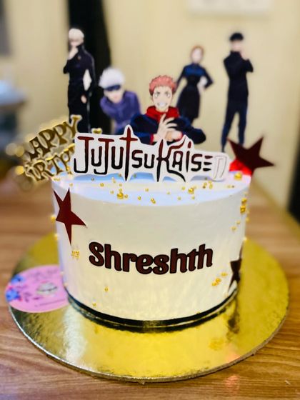 A stylish Jujutsu Kaisen themed cake for a fan of the popular anime series.