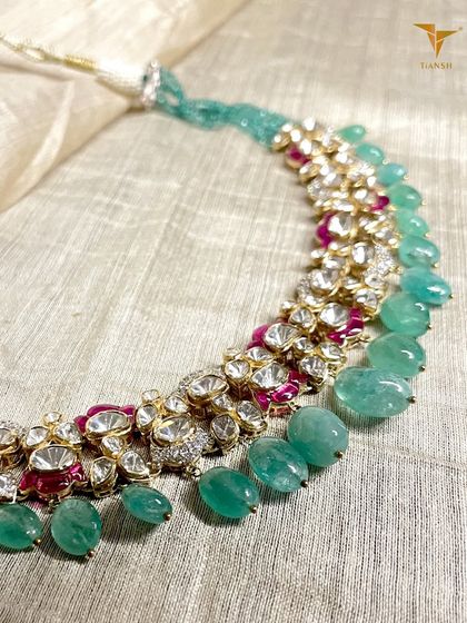 Because royalty is not a title, it is a state of mind. This regal necklace, woven in gold with Polki diamonds, deep rubies, and lush emeralds, is for the woman who commands attention with grace.