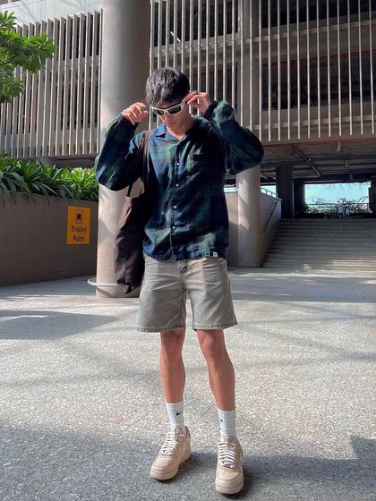 A client styling the coffee custom sneakers with a casual outfit.