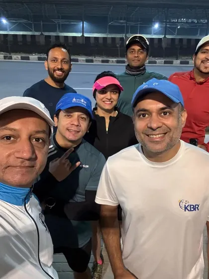 The team gathers for a photo during a night training session. We offer flexible training schedules to fit everyone's life.