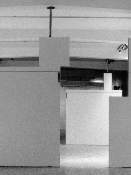 The renovation of the Jehangir Art Gallery was predicated on creating a flexible "white cube" space. The design uses a system of suspended, movable panels to allow for a multitude of exhibition layouts within the raw, stripped-down historic shell.