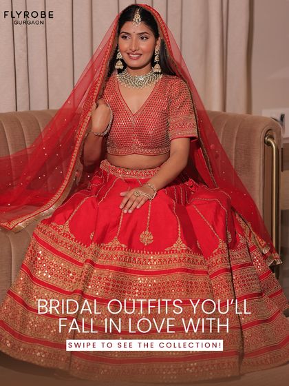 Fall in love with your bridal look, not the price tag. This model showcases a vibrant red lehenga with a V-neck blouse and a beautiful net dupatta, a classic choice for any bride.