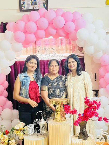 Three generations of women in my family: me, my mother, and my sister, celebrating together.