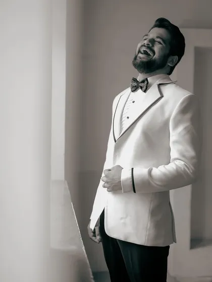 A joyful, black-and-white shot of Kshitish Date. It shows that the best style is the one you feel truly happy in.