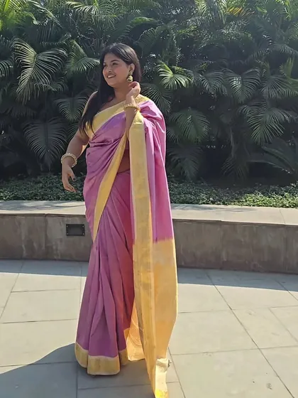 A full-length shot that shows how the saree is draped. I kept it classic and elegant to let the vibrant pink and gold colors really shine. This is a timeless look that works for any celebration.