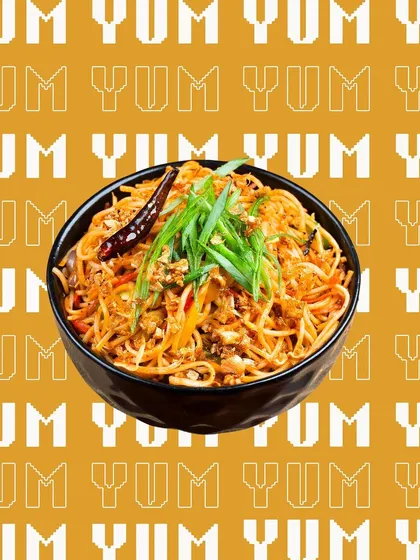 A bowl of noodles with a graphic "YUM" background. We also offer creative graphic design services to make your social media posts stand out.