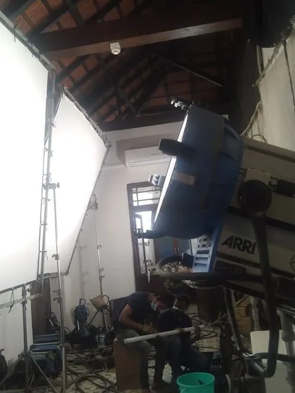 This wider shot shows the Arri M40 HMI being bounced into a 12x12 foot muslin frame. This is a common and highly effective technique our crews use to create large, soft sources of light in tight interior locations.