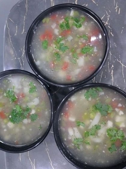 Bowls of my hearty vegetable soup, garnished with fresh coriander. It's a great way to start a meal or to have as a light dinner.
