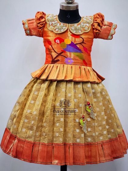 A unique lehenga featuring a Peter Pan collar and bird embroidery on the blouse, paired with a mustard-colored skirt.