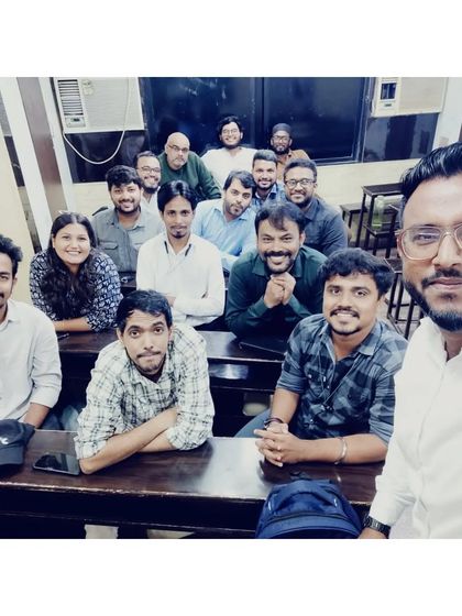 A selfie taken during a teachers' meeting. Our faculty regularly collaborates to plan curriculum and teaching strategies.