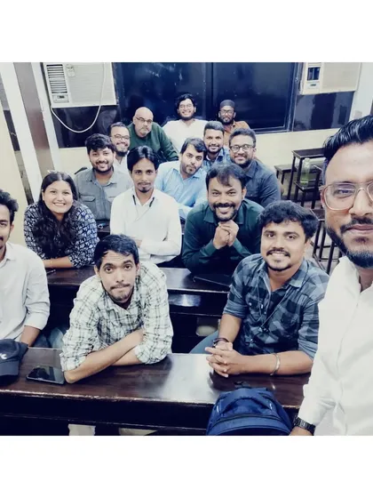 A selfie taken during a teachers' meeting. Our faculty regularly collaborates to plan curriculum and teaching strategies.