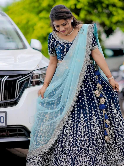 That glow when the outfit is just right. This client is rocking a custom navy blue velvet lehenga with silver embroidery, paired with a delicate sky-blue dupatta. It’s a regal look perfect for a reception or sangeet night.
