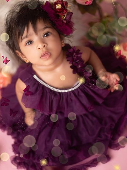 An overhead shot capturing the full, beautiful gown and the magical atmosphere of the princess theme. The soft lighting and sparkly effects add a touch of wonder to the portrait.