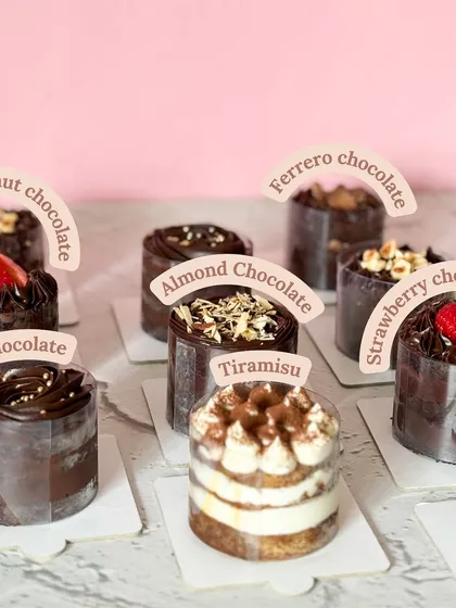 Can't decide on just one flavor? Our Mini Cakes Collection is for you. Mix and match any four of your favorites, from classic Chocolate to Tiramisu, to create your own perfect box of indulgence.