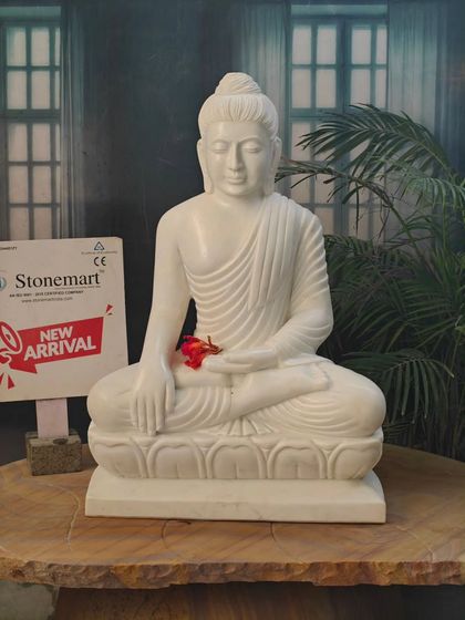 A close-up view of the 2.5-foot Bhumisparsha Buddha, highlighting the delicate hand carving and the peaceful expression of the deity.