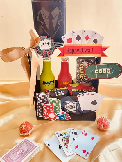 Get the party started with our Poker Night themed Diwali hamper. It includes everything needed for a fun card game night, from mocktails and coated peanuts to playful poker-themed decorations.
