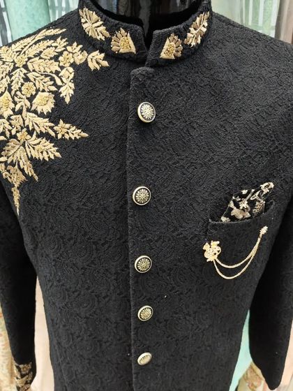 Another angle of the black Jodhpuri with gold embroidery, showing the pocket chain detail.