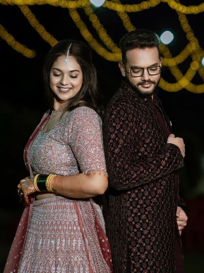 A fun and modern pose. Mrudhula's soft glam makeup and the groom's neat grooming come together for a stylish and contemporary reception look.