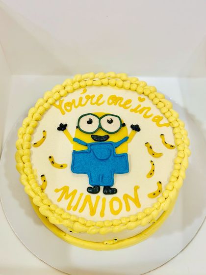 You're one in a minion. A fun and bright cake featuring a hand-piped Minion character, perfect for bringing a smile to anyone's face.