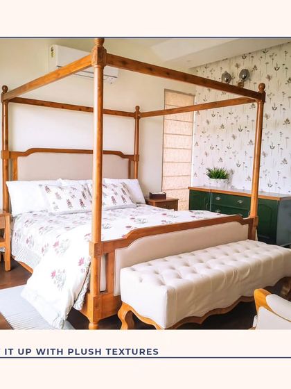 This bedroom features a classic four-poster bed, bringing a touch of timeless elegance. We paired it with a delicate floral wallpaper and a plush upholstered bench to create a cozy and opulent feel.