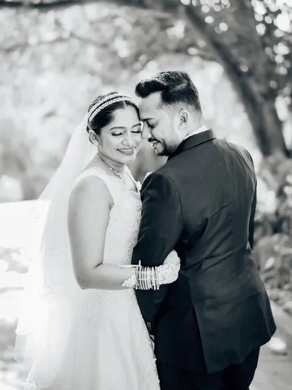 A soft and romantic black and white portrait of the couple. The monochrome tones emphasize their emotional connection and the beautiful natural light.