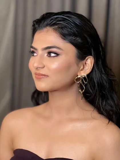 The side profile highlights the beautiful sheen on the skin and the soft contouring. This is a versatile look that enhances features naturally, making it a favorite for many of my clients.