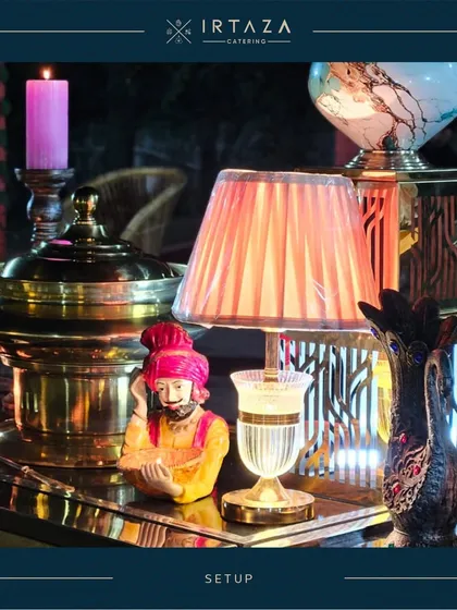 A quirky and artistic detail from one of my event setups. I enjoy incorporating unique decor elements like this traditional Rajasthani figurine and vintage-style lamp to add personality and charm to the buffet.