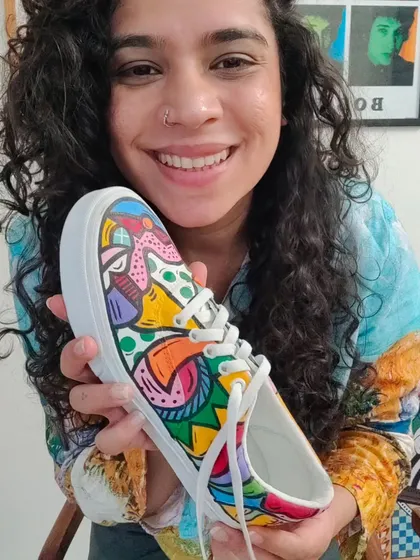 Who paints shoes this happily? A photo of me with a finished custom sneaker. The last photo is the real me, the rest is for the camera!