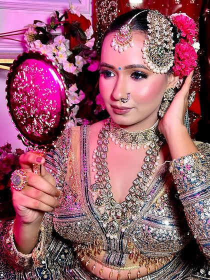 A stunning bridal portrait created during one of my pro makeup courses. The look features dramatic eyes, glowing skin, and floral hair accessories, showcasing the high-level skills I teach.