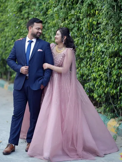 A lovely outdoor portrait of a couple during their pre-wedding or engagement celebration.