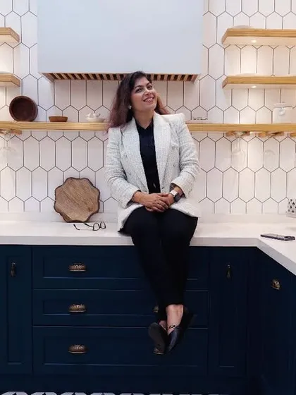 The kitchen is the heart of the home, and I love making it both beautiful and functional. Here I am in a recently completed kitchen featuring a trendy dual-tone design with classic white and bold navy blue, complemented by a patterned floor and smart storage. It’s a space designed for cooking, conversation, and creating memories.