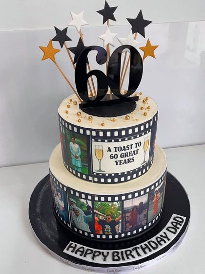 Another view of the personalized 60th birthday film reel cake, a blockbuster celebration of a great life.