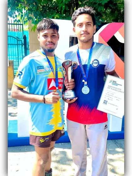Two of our Under-19 champions with their 2nd place medals and trophy from the SFA Championship.