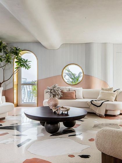 Another view of the living room, where the open layout and cohesive design language create the feeling of a large, uninterrupted volume.