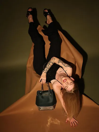An unconventional, gravity-defying pose that immediately grabs attention. This creative approach is perfect for brands looking to make a bold statement on social media.