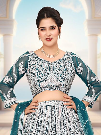 A closer look at the intricate silver detailing on the blouse of the bottle green lehenga.