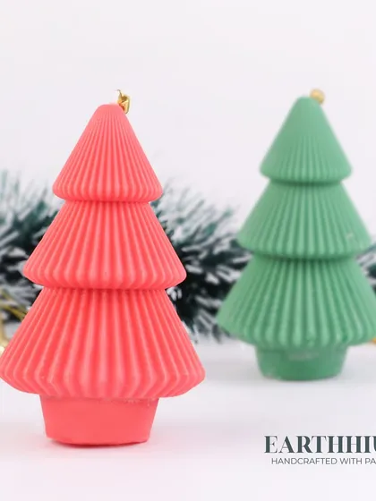 A closer look at the red and green Christmas tree candles.