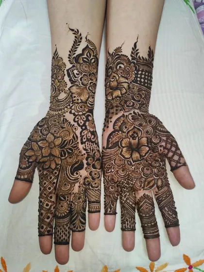 A full-coverage design with a mix of shaded flowers and delicate line work, creating a balanced and beautiful look.