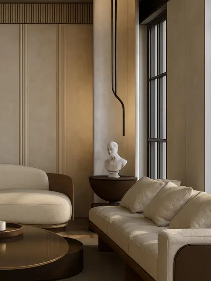 Natural light plays a crucial role in our designs. In this space, sunlight streams in, highlighting the soft textures of the furniture and the classical bust, creating a corner that feels both sophisticated and serene.
