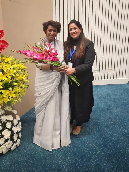Presenting flowers to a dignitary at the NALSA & NCW event.