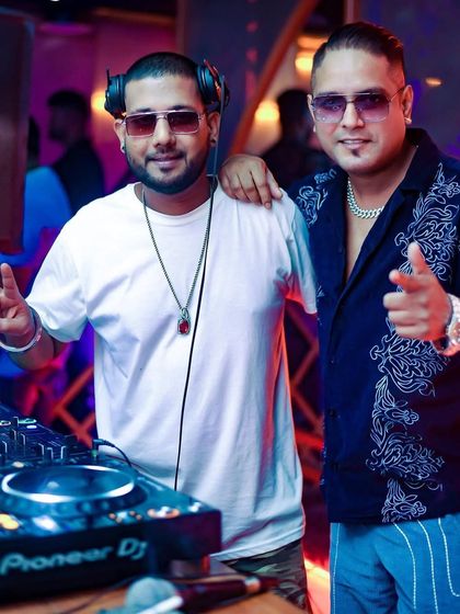 Two guys, one mission: keep the party alive. A shot with a fellow DJ, because collaboration is key in this industry.