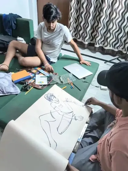 A behind-the-scenes look at a live sketching session in our studio. I am demonstrating how to create a quick figure drawing with bold ink lines, focusing on capturing the pose and energy of the model.