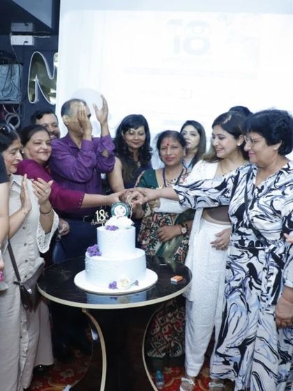 The cake-cutting ceremony from our 18th-anniversary event, a moment of shared joy and celebration with our team and clients.