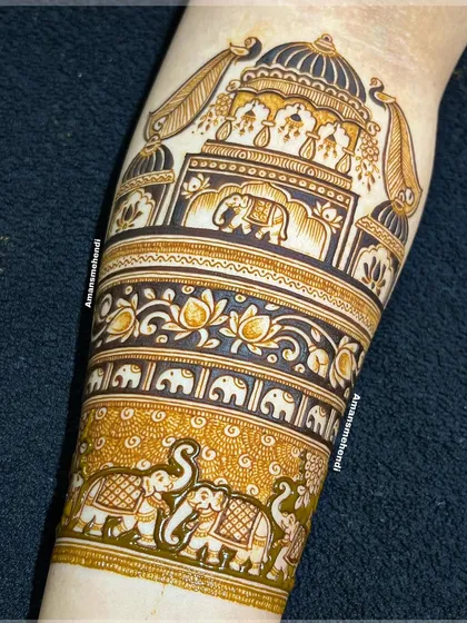 The completed arm band, filled with intricate details. The design features a grand palace, rows of small and large elephants, and delicate lotus patterns.
