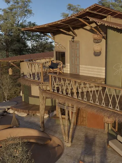 This elevated view highlights the multi-level design of the guest villas. The thatched roofs and rustic wooden railings are key elements of the resort's earthy aesthetic, providing both shade and a strong visual connection to traditional building techniques.