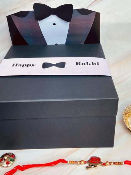 A dapper tuxedo-themed gift box for a brother this Rakhi. The box itself is a keeper, and it's ready to be filled with all his favorite things.
