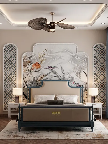 A master bedroom render with an Indochine theme. The design features a stunning wallpaper mural behind the bed, framed by custom-shaped paneling. The bed itself has a classic, elegant form.