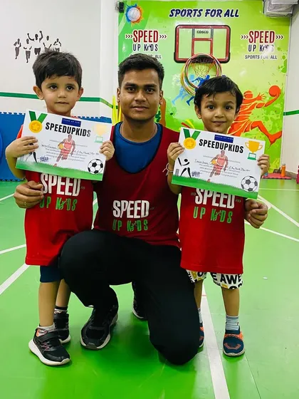 Two of our deserving champs holding up their 'Most Valuable Kid' certificates. Well done, boys.